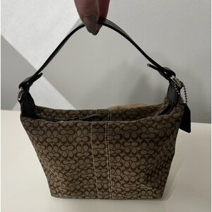 Coach brown fabric bag with leather handle. Barely used. Excellent condition.